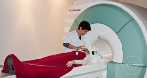 A person in a used MRI machine in a medical imaging facility